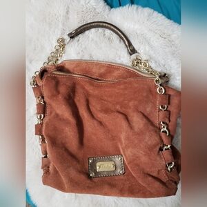 Muu brown leather back with good chain handle.